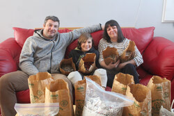 Photo caption: Desiring to help children with reduced mobility access the equipment they need, a local youngster and his family are eager to see their charitable collection come to fruition by donating buckets and bag loads of tabs from canned beverages to the Robert Hampson Tabs for Kids Fund. Photo: J-D Potié
