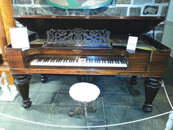 The mayor’s piano, a wooden square grand piano built by James Whiting Vose in 1857. The Symmes Inn Museum took possession of a piece of local history in 2013, thanks to a donation from the Gatineau Valley Historical Society.  Vose founded Vose & Sons in 1851 in Boston and built numerous grand, upright and square pianos that ended up in many parts of America, including West Quebec. The piano the museum obtained belonged to Thomas Brigham Prentiss, a former Aylmer councillor and mayor.
Originally from Vermont, Prentiss settled in Aylmer in 1854 after living in Chelsea for several years, where he operated a general store and worked for the post office. When Prentiss came to Aylmer, he opened a business on Aylmer’s rue Principale and got involved in municipal politics, first as a councillor in 1862 and later as mayor.
Prentiss only held the town hall’s top job from 1878 to 1879, but remained involved in municipal politics for many years. He retired in 1890 and passed away five years later. Prentiss also founded, with other members of the community, the Aylmer Academy, Aylmer’s first high school. Credit: Courtesy
