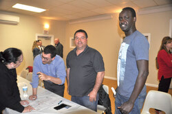 Owners of the Shawville slaughterhouse project engage with members of the public.