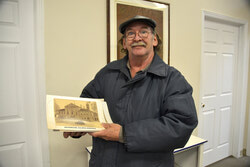 Gary Martineau working on the 2019 edition of the Aylmer Heritage calendar.
 Photo: Lily Ryan