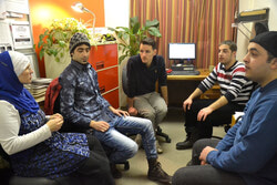 Laurent Robillard-Cardinal (centre) interviewing three refugees from Syria, Mohammad Al Mohammad, Nemer and Zakariyya Masri who arrived in Aylmer two weeks ago, as well as their local contact and guide, Astride Le Jeune. Read the full story in the Bulletin. Photo: Lily Ryan