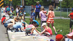 Students from Lord Aylmer Elementary School participate in the street-chalking event held by the Optimist Club of Aylmer.  	
Photo: Amanda Russell
