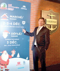 Mike Clemann, owner of the British Hotel,
describing the December 2-4 Christmas Market.	Photo: LRC