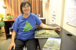 Suzanne Hardy, with reports published about remarkable trees in Laval and for Hydro-Quebec. 	Photo: Lily Ryan
