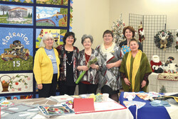 Esthere Cyr Nadeau, Chantal Arsenault, Georgette Lachance, Denise Boivert and Églantine Imbeault of the administrative council of Aylmer’s Branch of Le Cercle de Fermières du Québec (CFQ) stand with the group’s founder Cecil Dumouchel, centre, at the celebration  of CFQ’s 100th anniversary on February 20.
Photo: Nick Seebruch