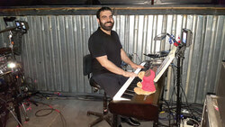 Former St. Mark the Evangelist Catholic Church Music Director Chris Santillán playing the Mamma Mia! songs at Place des Arts in Montreal this past February.	Photo: Courtesy