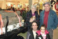 A sure sign of spring:
The Galeries Aylmer Outdoor show! Many Aylmerites stopped by the Galeries Aylmer on the first day of spring, March 20, to check out the vehicles that they hope will be a part of their outdoor fun this year.  Numerous campers, ATVs and other vehicles were on display during the annual Outdoor show, which was held throughout the weekend.  Luc Marengère and his five year-old daughter, Oceane, both of Poltimore, enjoyed looking around with Mr. Marengère’s parents Giselle and Bernard.  (JM)
Photo: JM