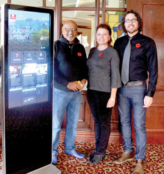 Zool Gova, Else-Britt Godo and Alain Charbonneau at the City Guide launch, standing next to the smart-screen 
information tower.	Photo: Lily Ryan